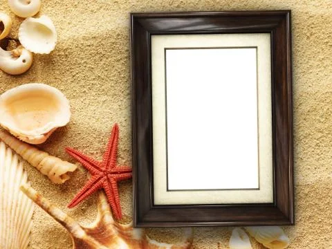 Picture frame on shells and sand background Stock Photos