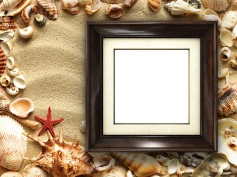 Picture frame on shells and sand background Stock Photos