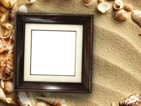 Picture frame on shells and sand background Stock Photos