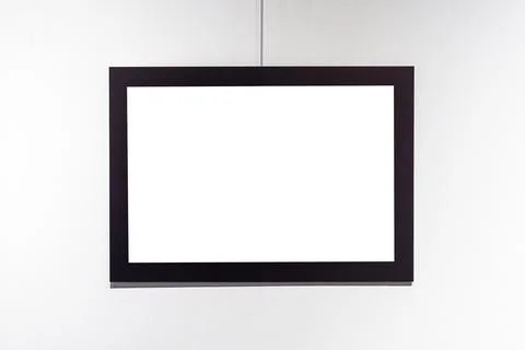 Picture frames with copy space for text hanging on the wall with wallpaper... Stockfoto's