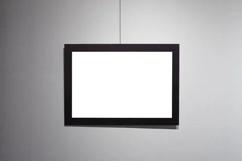 Picture frames with copy space for text hanging on the wall with wallpaper... 写真素材