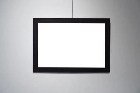 Picture frames with copy space for text hanging on the wall with wallpaper... Stockfoto's