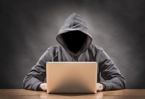 Picture of a hacker on a computer Stock Photos
