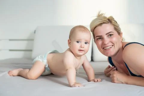 Picture of happy mother with baby over white Stock Photos