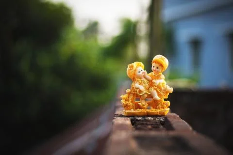 A picture of intimacy of a couple showpiece laid on the roof surface Stock Photos