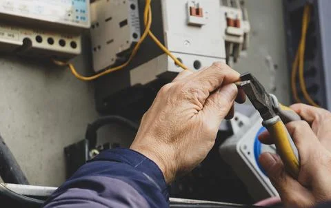A picture of a man working on something Stock Photos
