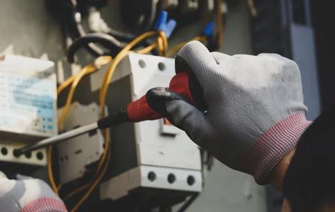 A picture of a man working on something Stock Photos