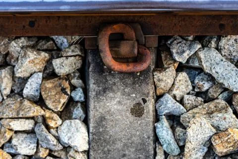 Picture of old iron that has rust on the railroad tracks and many rocks Stock Photos