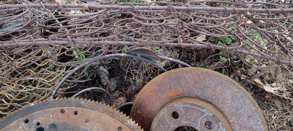 Picture of rusty metal objects piled outside Stock Photos