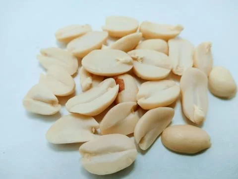 A picture of split Peanuts isolated on white background Stock Photos