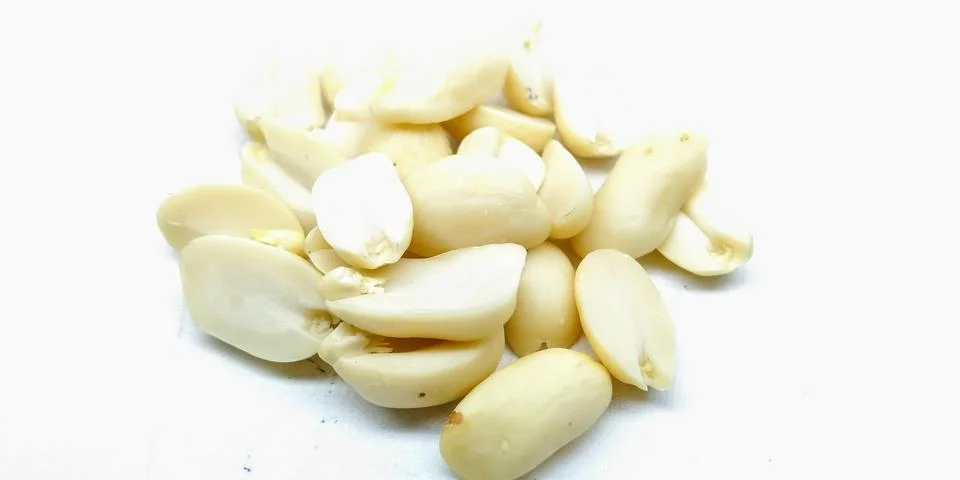 A picture of split Peanuts isolated on white background Stock Photos
