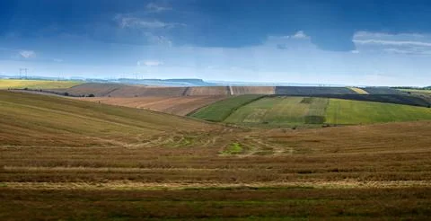 Picturesque agricultural fields under a cloudy stormy sky Foto stock