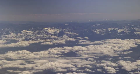 Picturesque Alps in the clouds, 4K Stock Footage 221260791
