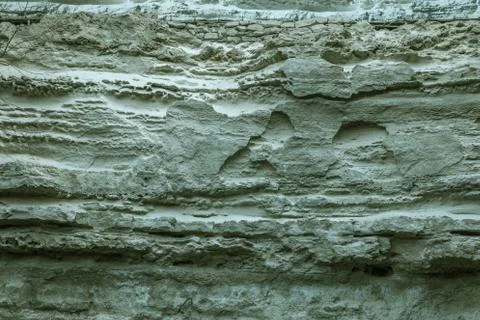 Picturesque background of collapsing surface of limestone rock. Abstract beau Stock Photos