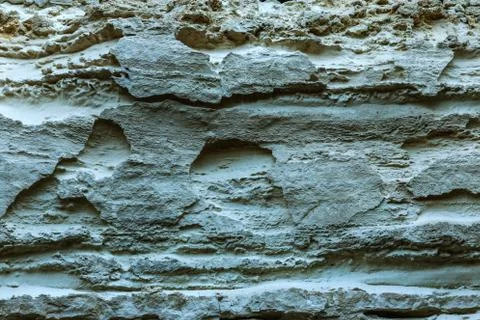 Picturesque background of collapsing surface of limestone rock. Abstract beau Stock Photos