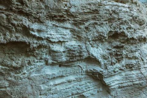 Picturesque background of collapsing surface of limestone rock. Abstract beau Stock Photos