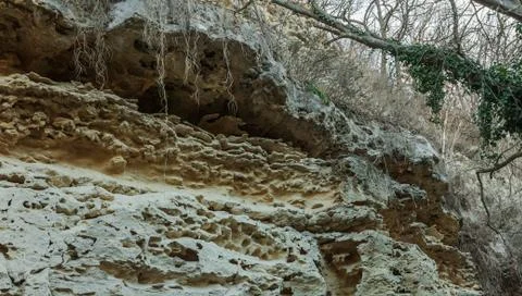 Picturesque background of collapsing surface of limestone rock. Abstract beau Stock Photos