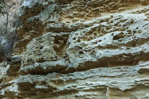Picturesque background of collapsing surface of limestone rock. Abstract beau Stock Photos