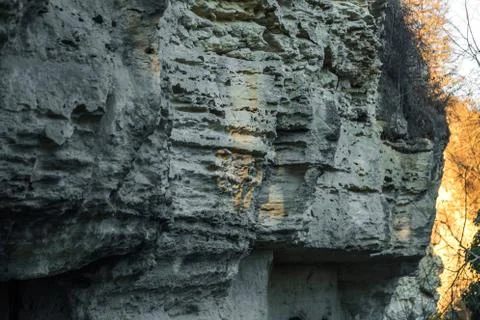 Picturesque background of collapsing surface of limestone rock. Abstract beau Stock Photos