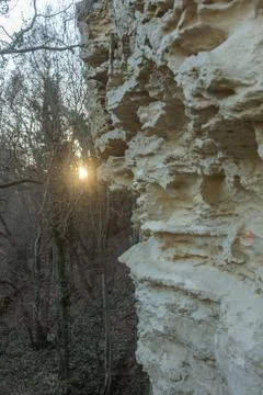 Picturesque background of collapsing surface of limestone rock. Abstract beau Stock Photos