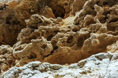 Picturesque background of collapsing surface of limestone rock. Abstract beau Stock Photos