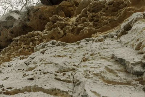 Picturesque background of collapsing surface of limestone rock. Abstract beau Stock Photos