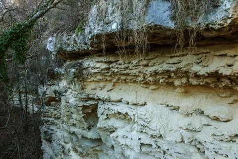 Picturesque background of collapsing surface of limestone rock. Abstract beau Stock Photos