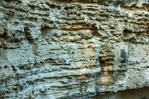 Picturesque background of collapsing surface of limestone rock. Abstract beau Stock Photos