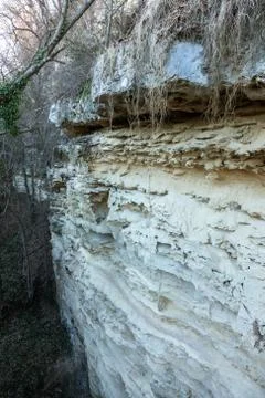 Picturesque background of collapsing surface of limestone rock. Abstract beau Stock Photos