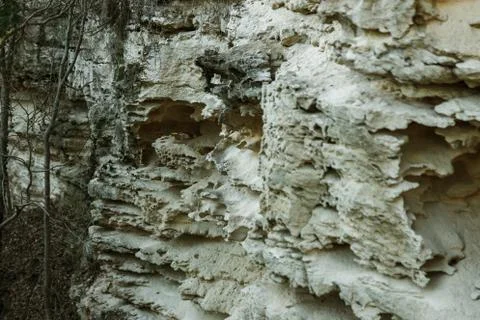 Picturesque background of collapsing surface of limestone rock. Abstract beau Stock Photos