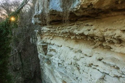 Picturesque background of collapsing surface of limestone rock. Abstract beau Stock Photos
