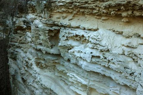 Picturesque background of collapsing surface of limestone rock. Abstract beau Stock Photos