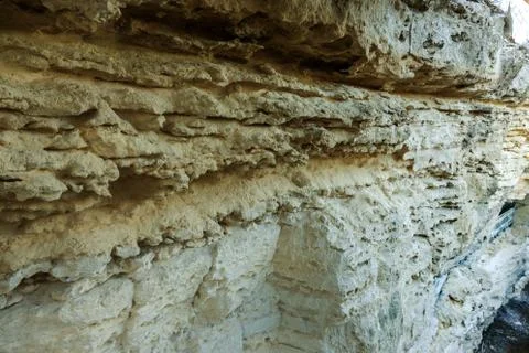 Picturesque background of collapsing surface of limestone rock. Abstract beau Stock Photos