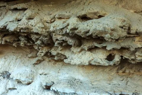 Picturesque background of collapsing surface of limestone rock. Abstract beau Stock Photos