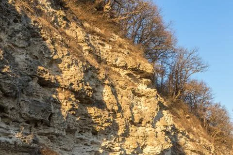 Picturesque background of collapsing surface of limestone rock. Abstract beau Stock Photos