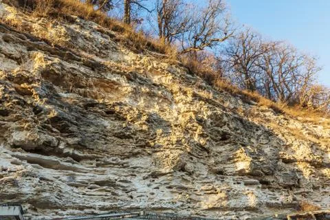 Picturesque background of collapsing surface of limestone rock. Abstract beau Stock Photos
