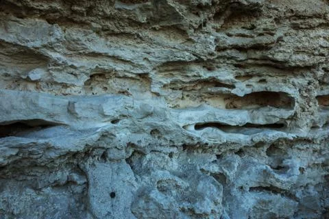 Picturesque background of collapsing surface of limestone rock. Abstract beau Stock Photos