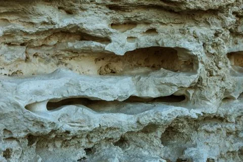 Picturesque background of collapsing surface of limestone rock. Abstract beau Stock Photos