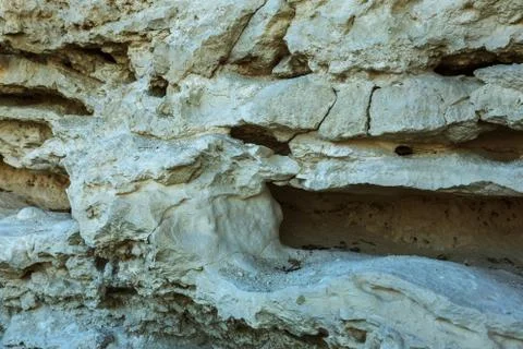 Picturesque background of collapsing surface of limestone rock. Abstract beau Stock Photos