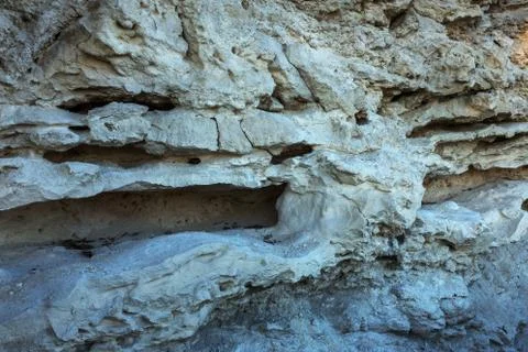 Picturesque background of collapsing surface of limestone rock. Abstract beau Stock Photos