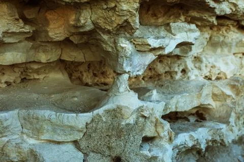 Picturesque background of collapsing surface of limestone rock. Abstract beau Stock Photos