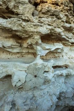 Picturesque background of collapsing surface of limestone rock. Abstract beau Stock Photos