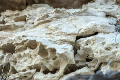 Picturesque background of collapsing surface of limestone rock. Abstract beau Stock Photos