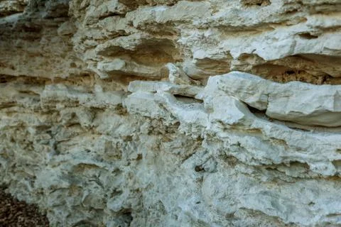 Picturesque background of collapsing surface of limestone rock. Abstract beau Stock Photos