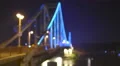 picturesque backlight on the pedestrian bridge. Evening night time. Wide angle 4k or 4k+ Resolution