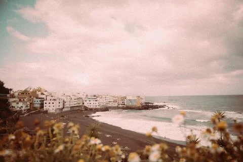 Picturesque beach, featuring a colorful array of buildings along the shore with Fotos de archivo