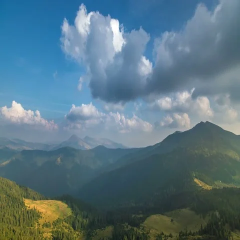 The picturesque cloud stream against the background of a mountain. Wide angle Stock Footage 69487913