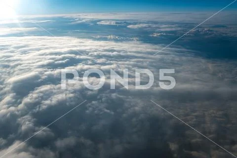 The picturesque cloud view on the background of bright sun Stock Photos