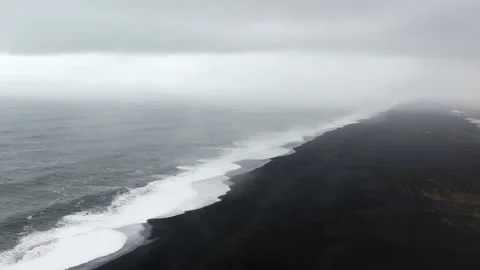 Picturesque dramatic popular panorama to endless ocean black volcanic sand .. Stock-Footage 238046113