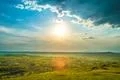 The picturesque field on the background of sunrise. Wide angle Photo